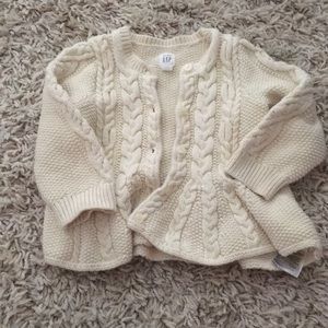 Adorable cream cable knit cardigan.